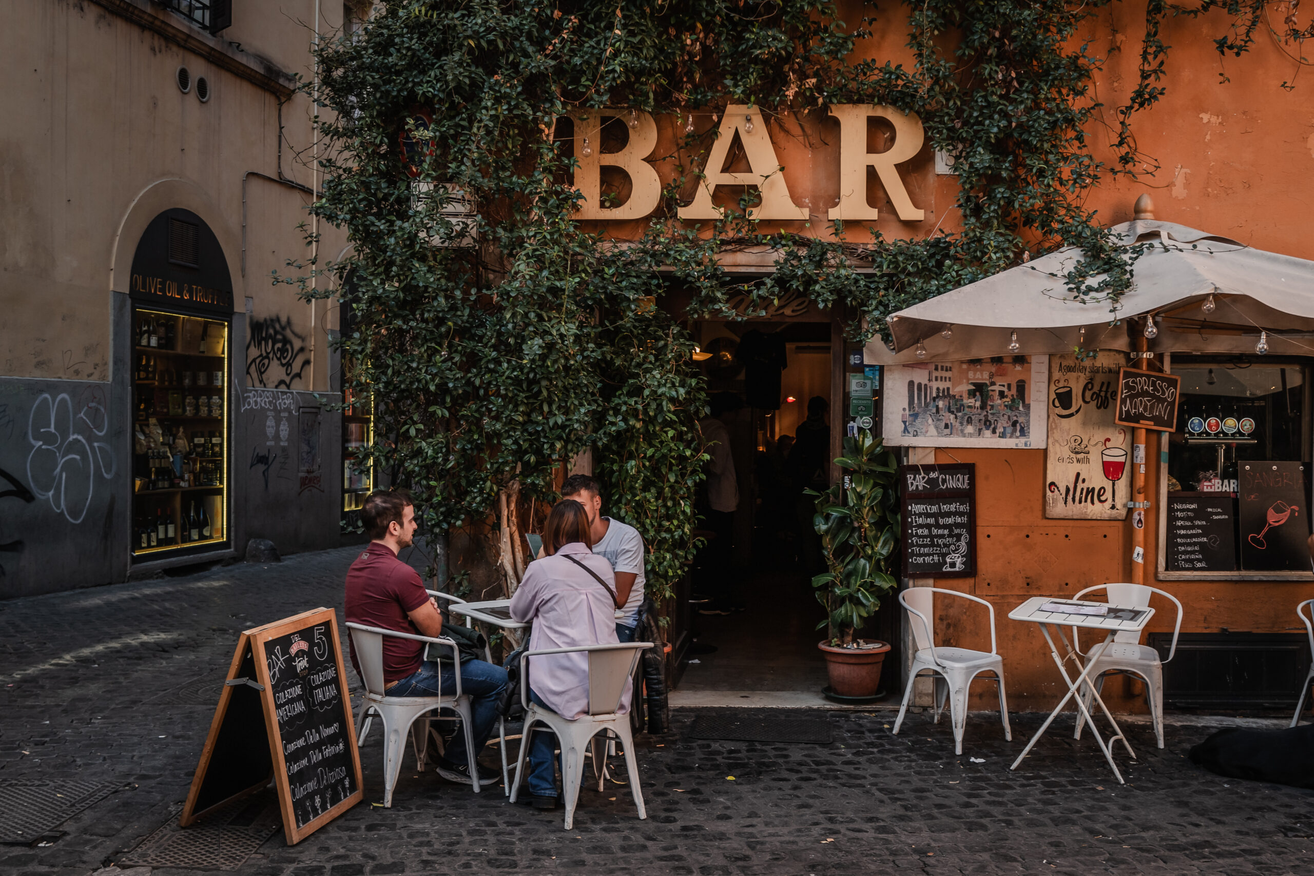 Rome, Italy- November 2022: People siting at the bar having brea